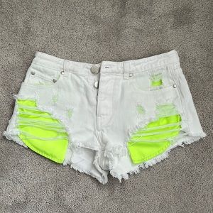 White Jean shorts with neon pockets
